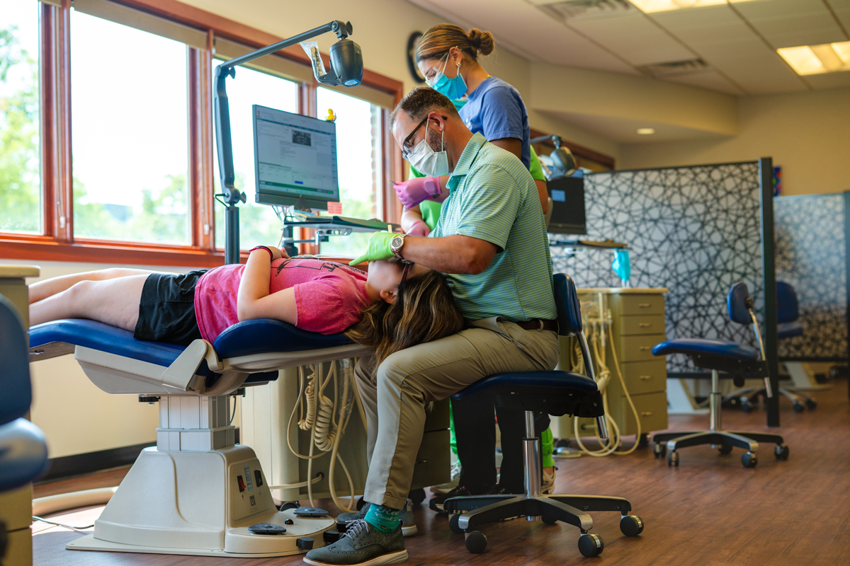 Dr Cook Performing Orthodontic Procedure